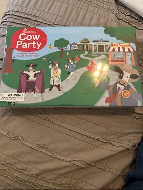 Cow Party game.  New in package